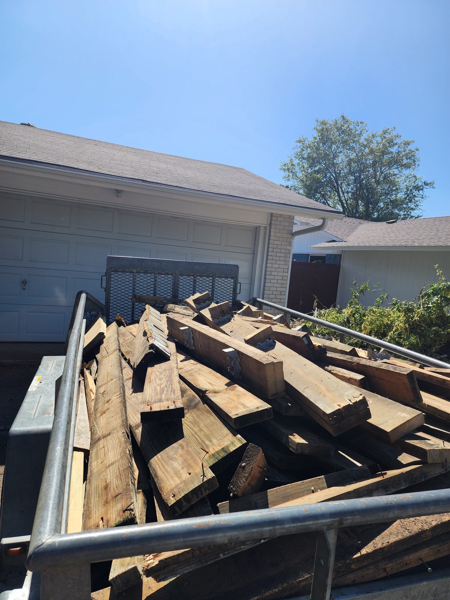 BlackIron Hauling junk removal crew loading items in Dallas-Fort Worth