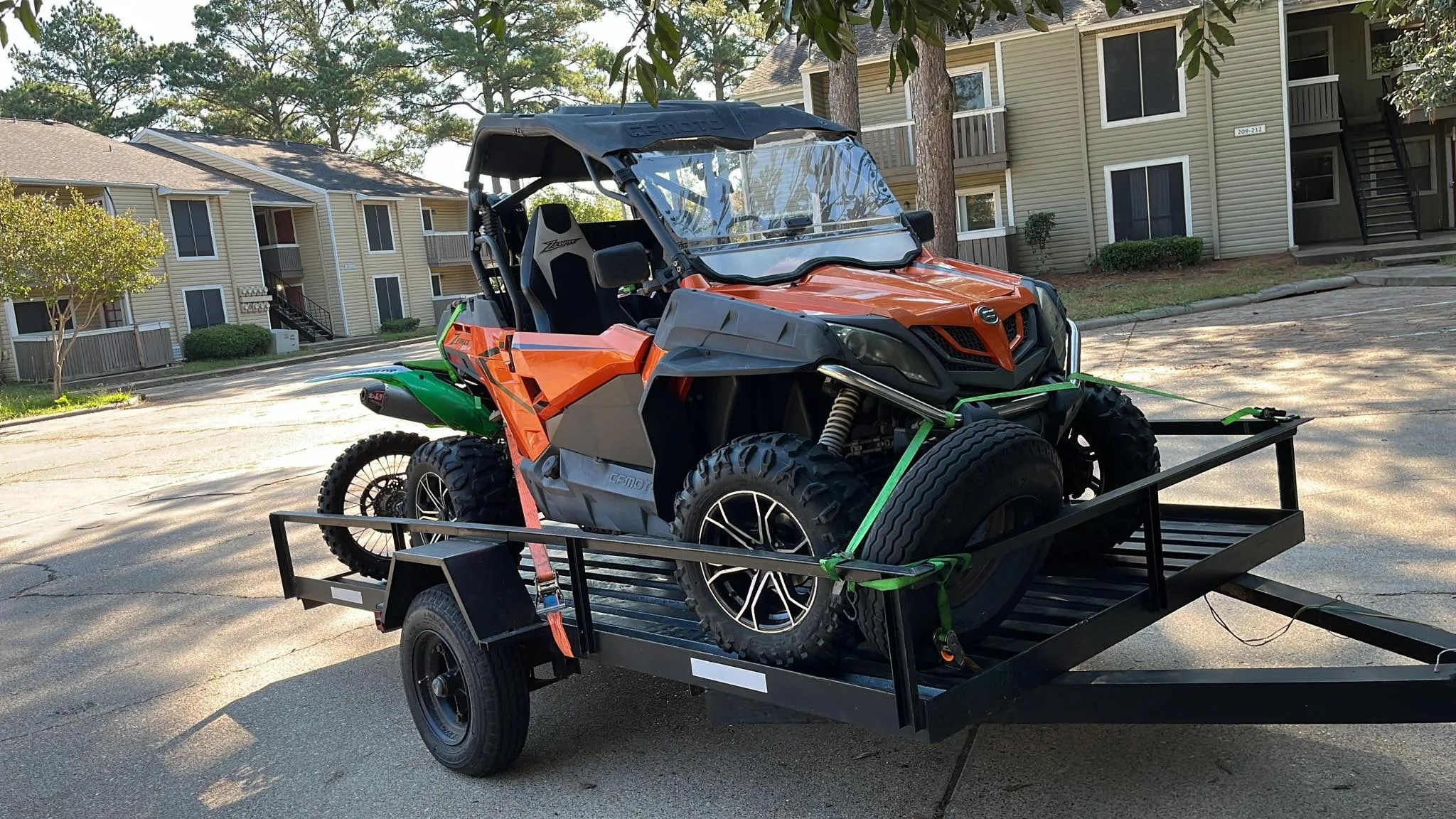 BlackIron Hauling utility trailer loaded with a UTV side-by-side demonstrating hauling versatility